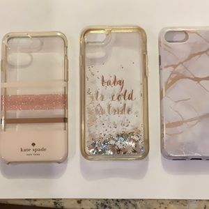 3 iPhone 8 cases.Two are KateSpade cases.